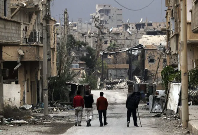 Economic crisis and infighting within the Assad family envelopes war-ravaged Syria  