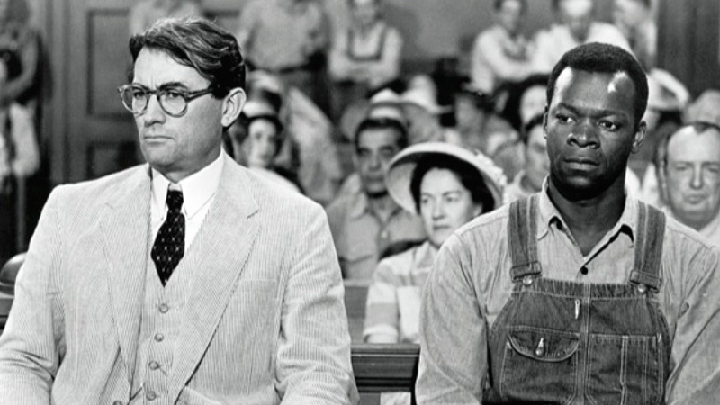 The characters Aticus Finch and Tom Robinson in the film adaptation of Harper Lee's To Kill a Mockingbird